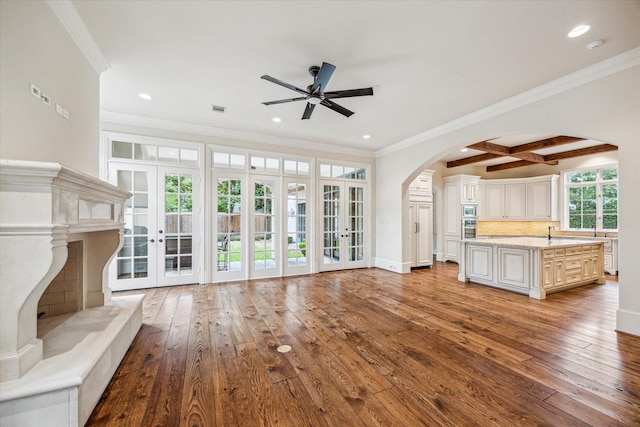 3423 Ella Lee Ln, Houston, TX 77027 - unfurnished living room featuring ceiling fan, arched walkways, hardwood / wood-style flooring, recessed lighting, and ornamental molding