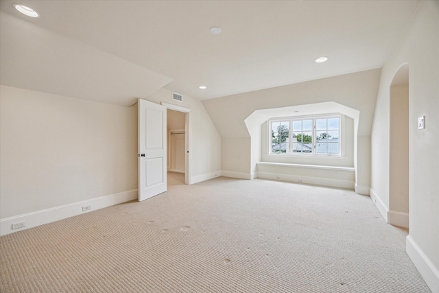 3423 Ella Lee Ln, Houston, TX 77027 - additional living space featuring light carpet, baseboards, lofted ceiling, recessed lighting, and arched walkways