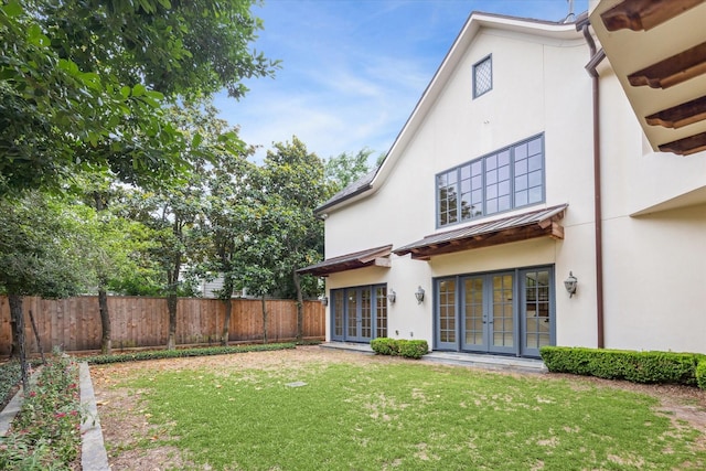 3423 Ella Lee Ln, Houston, TX 77027 - rear view of property featuring french doors, stucco siding, a standing seam roof, and metal roof