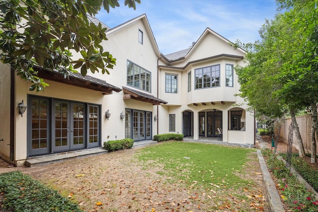 3423 Ella Lee Ln, Houston, TX 77027 - back of property with french doors and stucco siding