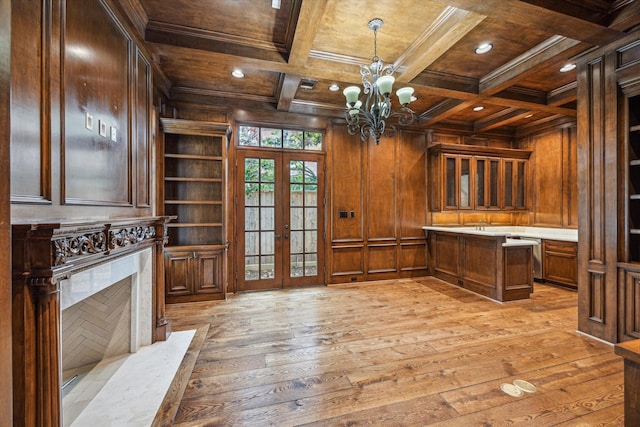 3423 Ella Lee Ln, Houston, TX 77027 - unfurnished office featuring wooden ceiling with exposed beams, french doors, wooden walls, light wood-style floors, and built in shelves