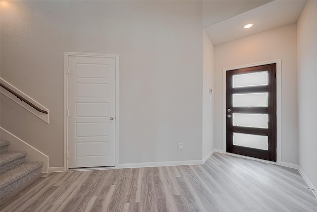 5819 Grantgrala Dr, Katy, TX 77493 - entryway featuring light wood-style floors, stairway, baseboards, and recessed lighting