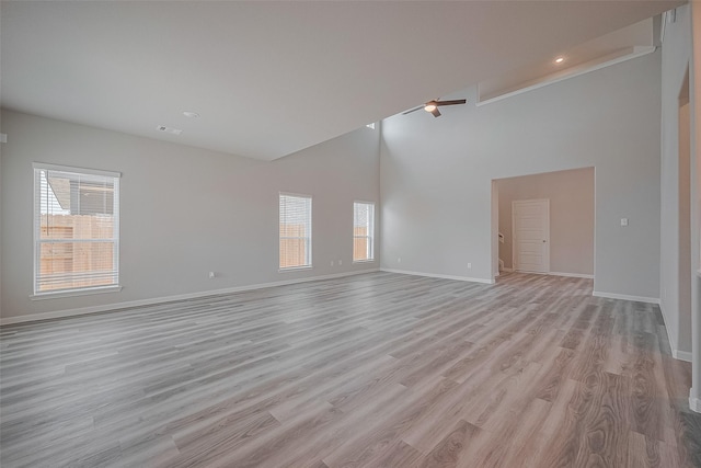5819 Grantgrala Dr, Katy, TX 77493 - empty room featuring high vaulted ceiling, baseboards, light wood-style floors, recessed lighting, and ceiling fan