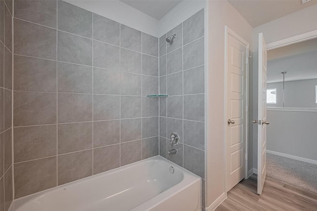 5819 Grantgrala Dr, Katy, TX 77493 - full bathroom featuring wood finished floors, washtub / shower combination, and baseboards