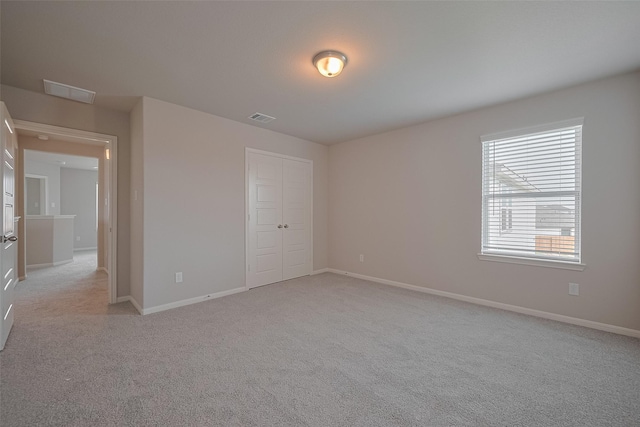 5819 Grantgrala Dr, Katy, TX 77493 - unfurnished bedroom featuring light colored carpet, a closet, and baseboards