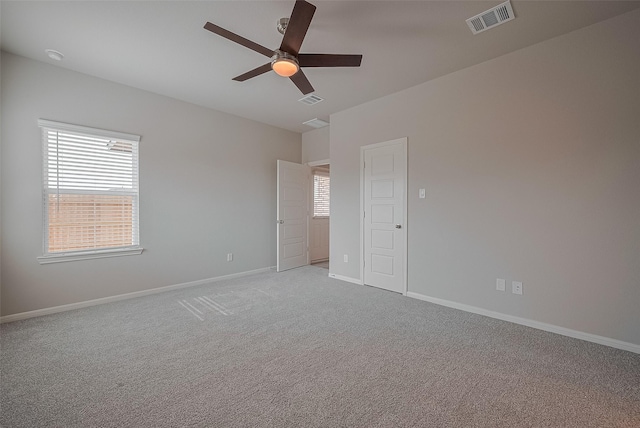 5819 Grantgrala Dr, Katy, TX 77493 - spare room featuring a ceiling fan, light carpet, baseboards, and a smoke detector