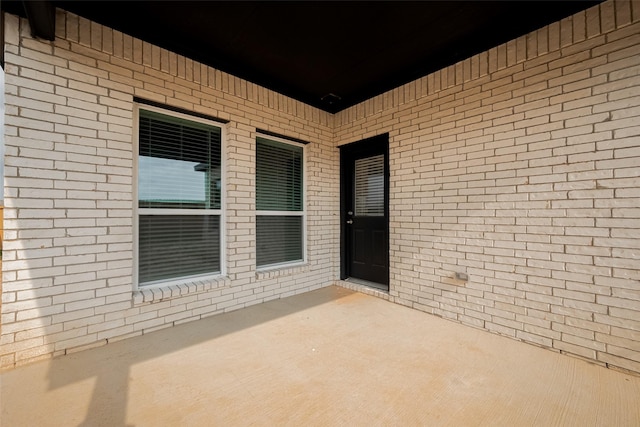 5819 Grantgrala Dr, Katy, TX 77493 - view of exterior entry featuring a patio and brick siding