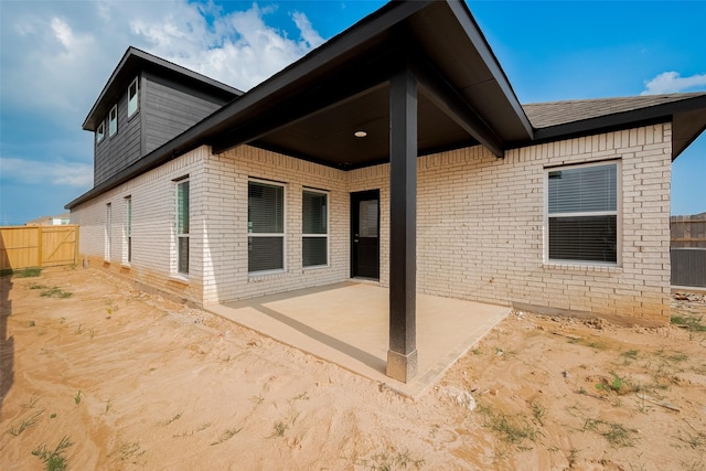 5819 Grantgrala Dr, Katy, TX 77493 - rear view of property with a patio area and brick siding
