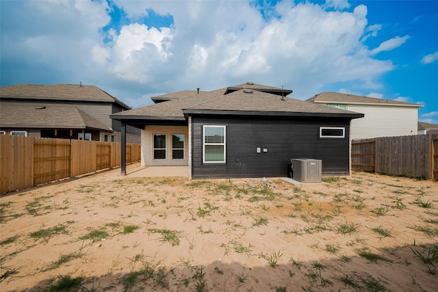 5819 Grantgrala Dr, Katy, TX 77493 - rear view of property featuring a fenced backyard, cooling unit, a patio, and a shingled roof