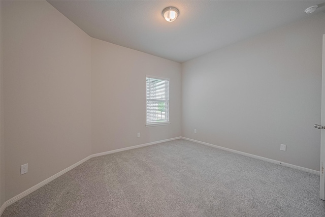 5819 Grantgrala Dr, Katy, TX 77493 - spare room featuring carpet, baseboards, and a smoke detector