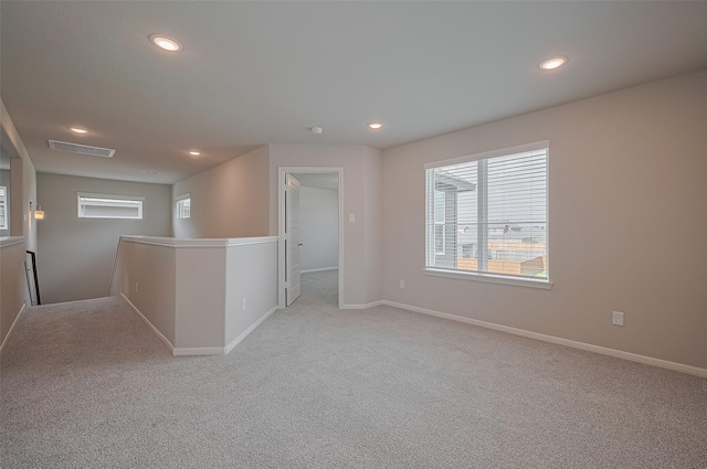 5819 Grantgrala Dr, Katy, TX 77493 - empty room with recessed lighting, light colored carpet, and baseboards