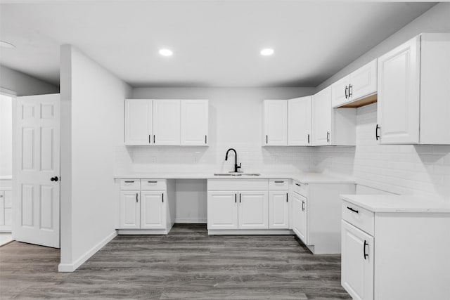 4002 Rutland St, Houston, TX 77018 - kitchen with recessed lighting, a sink, decorative backsplash, and white cabinetry