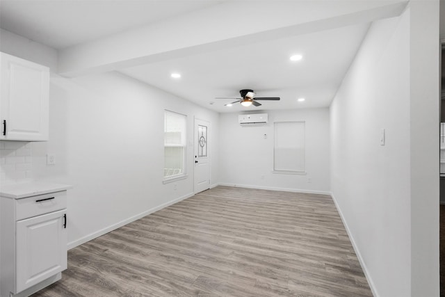 4002 Rutland St, Houston, TX 77018 - empty room featuring a wall mounted air conditioner, a ceiling fan, light wood finished floors, recessed lighting, and baseboards