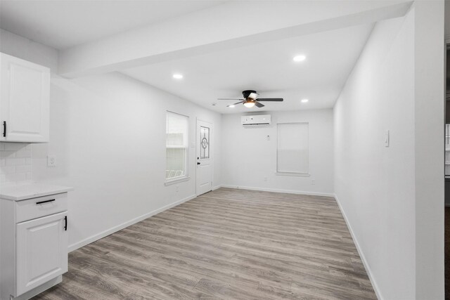 4002 Rutland St, Houston, TX 77018 - empty room featuring a wall mounted air conditioner, a ceiling fan, light wood-type flooring, recessed lighting, and baseboards