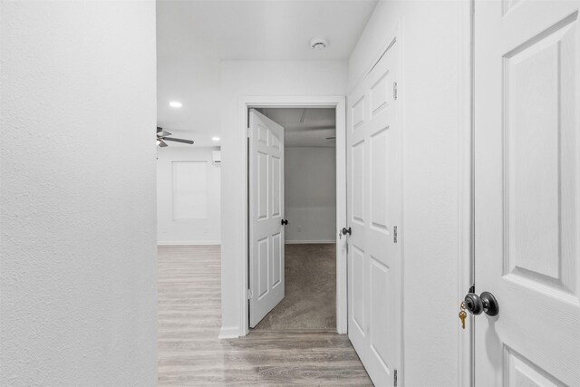 4002 Rutland St, Houston, TX 77018 - hall featuring light wood-type flooring, recessed lighting, and baseboards