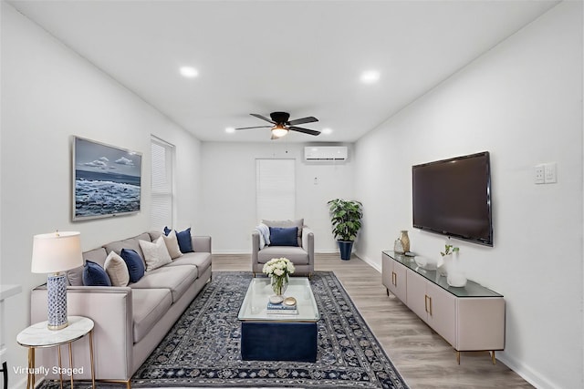 4002 Rutland St, Houston, TX 77018 - living area with a ceiling fan, an AC wall unit, light wood finished floors, baseboards, and recessed lighting