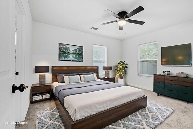 4002 Rutland St, Houston, TX 77018 - bedroom with light carpet, baseboards, and a ceiling fan