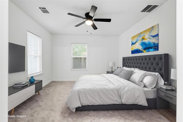 4002 Rutland St, Houston, TX 77018 - bedroom featuring light colored carpet, baseboards, and a ceiling fan