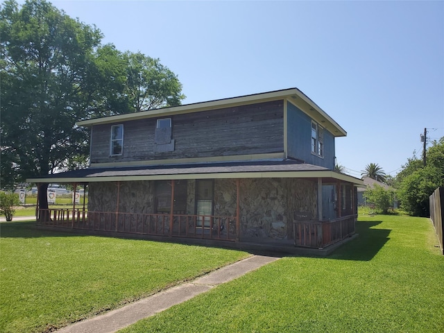 1101 4th Ave N, Texas City, TX 77590 - rear view of property with a yard and stone siding
