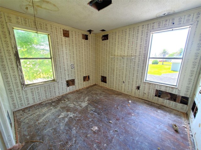 1101 4th Ave N, Texas City, TX 77590 - empty room with ornamental molding and a textured ceiling