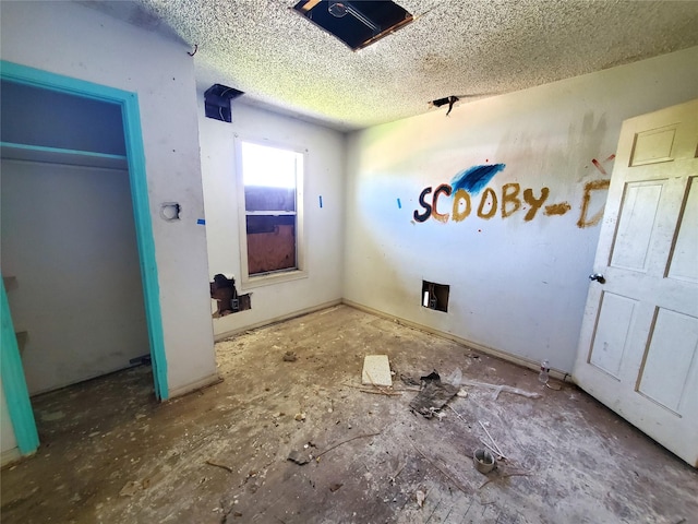 1101 4th Ave N, Texas City, TX 77590 - unfurnished bedroom with a textured ceiling
