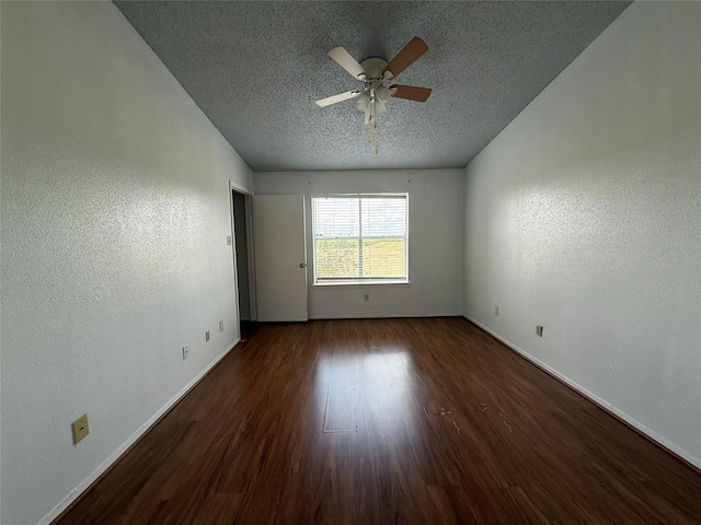 10555 Turtlewood Ct Unit 2011, Houston, TX 77072 - empty room with a textured ceiling, baseboards, ceiling fan, wood finished floors, and a textured wall