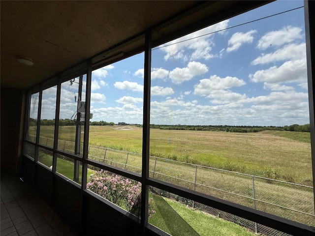 10555 Turtlewood Ct Unit 2011, Houston, TX 77072 - unfurnished sunroom featuring a rural view, tile patterned flooring, and healthy amount of natural light