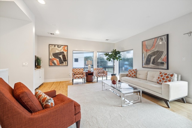 4502 Maxie St Unit A, Houston, TX 77007 - living room featuring light wood-style floors, recessed lighting, and baseboards