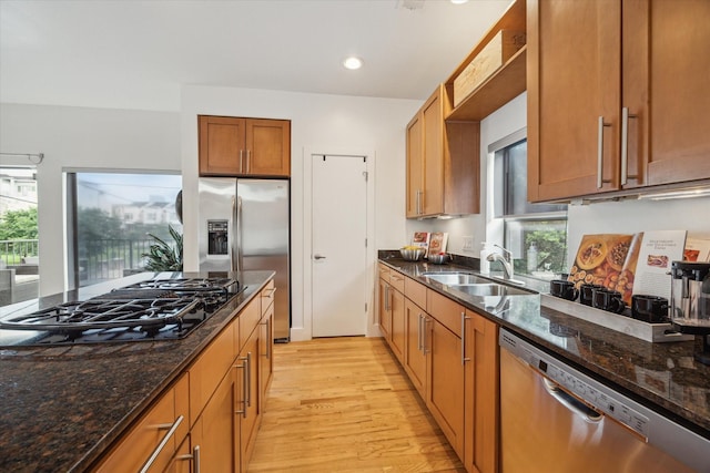 4502 Maxie St Unit A, Houston, TX 77007 - kitchen with appliances with stainless steel finishes, a sink, light wood-type flooring, plenty of natural light, and recessed lighting