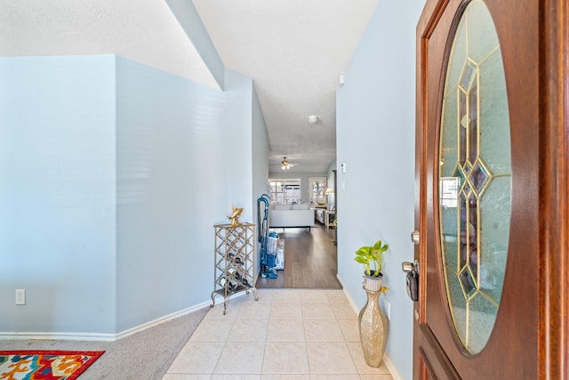 2442 Floral Ridge Dr, Spring, TX 77388 - entrance foyer featuring baseboards, light tile patterned floors, and a ceiling fan