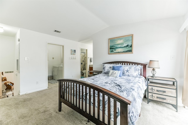 3506 Cove View Blvd Unit 506, Galveston, TX 77554 - carpeted bedroom with washer and clothes dryer, lofted ceiling, connected bathroom, and baseboards