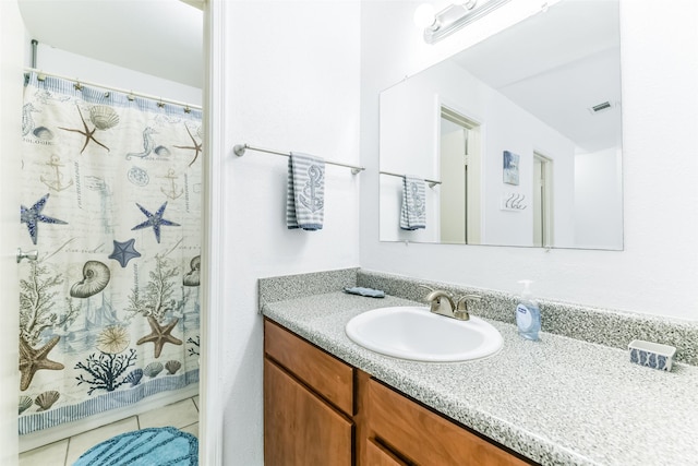 3506 Cove View Blvd Unit 506, Galveston, TX 77554 - bathroom featuring vanity, tile patterned flooring, and a shower with curtain