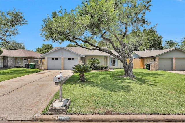7322 Sawmill Trl, Houston, TX 77040 - view of front facade featuring brick siding, concrete driveway, and a front lawn