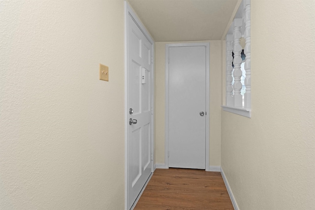 7322 Sawmill Trl, Houston, TX 77040 - hall with dark wood-type flooring and baseboards