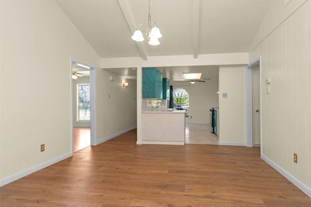 7322 Sawmill Trl, Houston, TX 77040 - unfurnished living room featuring a chandelier, healthy amount of natural light, light wood-style floors, and a ceiling fan