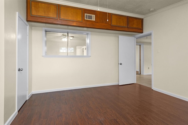 7322 Sawmill Trl, Houston, TX 77040 - empty room with dark wood finished floors, a ceiling fan, baseboards, and crown molding