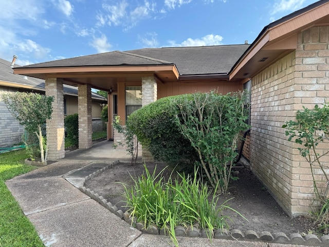 11207 Windmark Pl, Houston, TX 77099 - property entrance featuring roof with shingles and board and batten siding