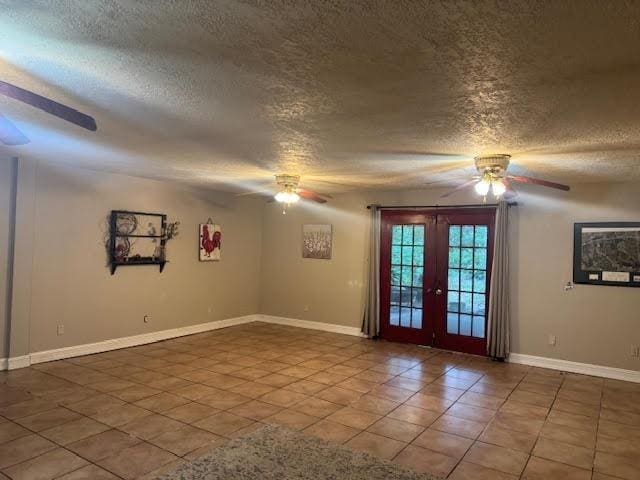 3475 Pelican St, Pinehurst, TX 77630 - unfurnished room featuring a ceiling fan, french doors, a textured ceiling, baseboards, and tile patterned floors