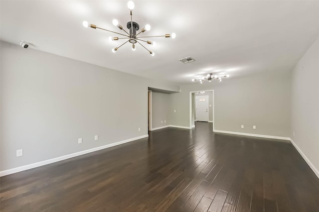9207 Timberside Dr, Houston, TX 77025 - unfurnished room featuring a chandelier, baseboards, and dark wood finished floors