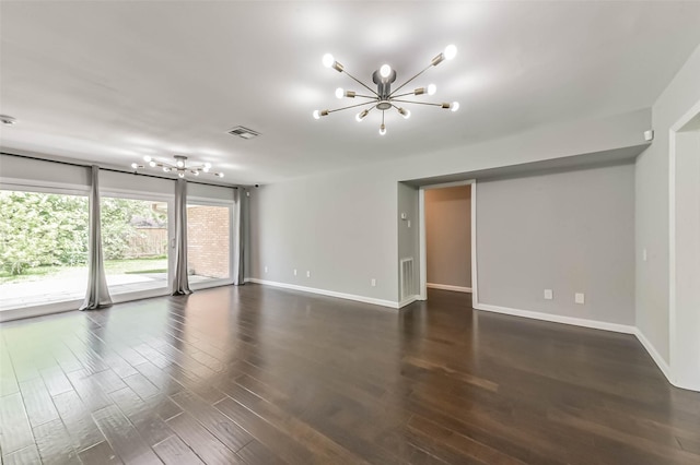 9207 Timberside Dr, Houston, TX 77025 - empty room with a chandelier, baseboards, and dark wood-style flooring