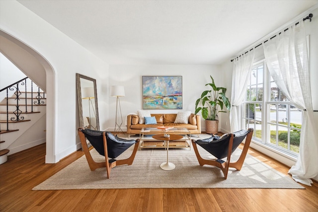 2108 Branard St, Houston, TX 77098 - living area featuring stairs, baseboards, and wood finished floors