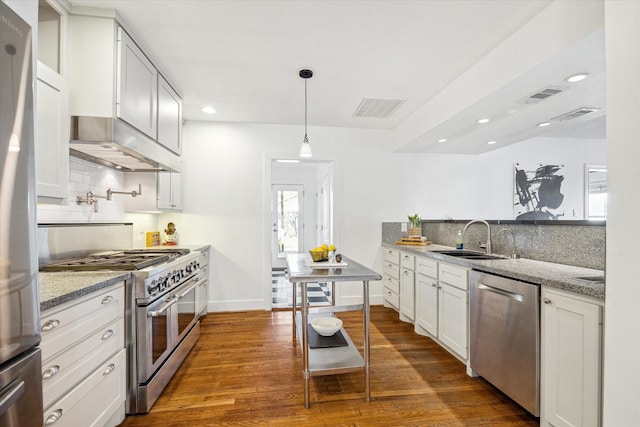2108 Branard St, Houston, TX 77098 - kitchen featuring stainless steel appliances, a sink, extractor fan, backsplash, and dark wood-style flooring