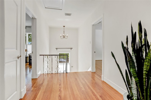 2108 Branard St, Houston, TX 77098 - entrance foyer with wood finished floors, baseboards, and a chandelier