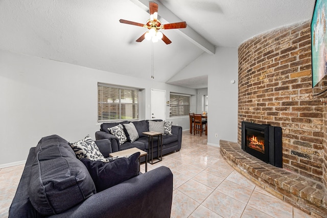 1343 Somercotes Ln, Channelview, TX 77530 - living room with ceiling fan, light tile patterned floors, baseboards, a brick fireplace, and a textured ceiling