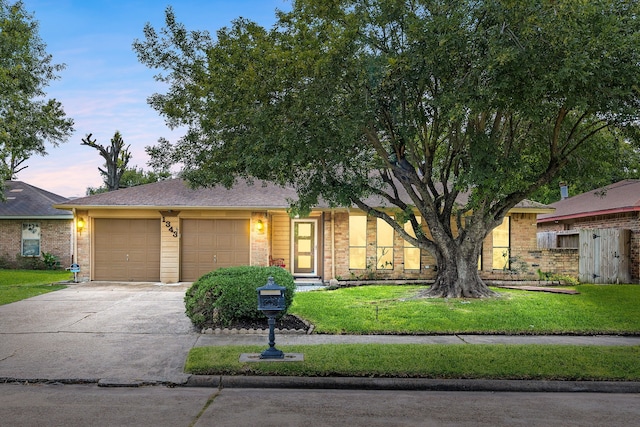1343 Somercotes Ln, Channelview, TX 77530 - view of front of property with a garage, driveway, and brick siding