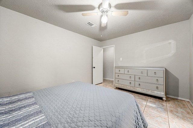 1343 Somercotes Ln, Channelview, TX 77530 - bedroom featuring tile patterned floors, a ceiling fan, and baseboards