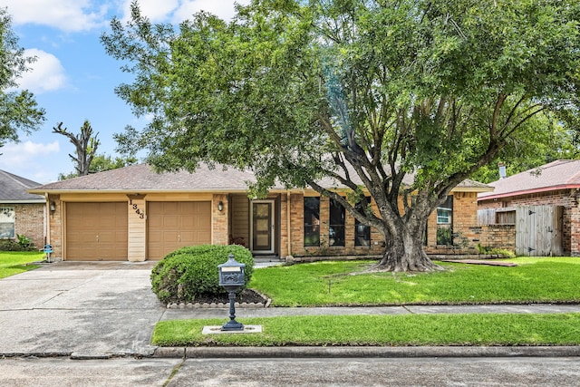 1343 Somercotes Ln, Channelview, TX 77530 - view of front facade with a garage, driveway, and brick siding