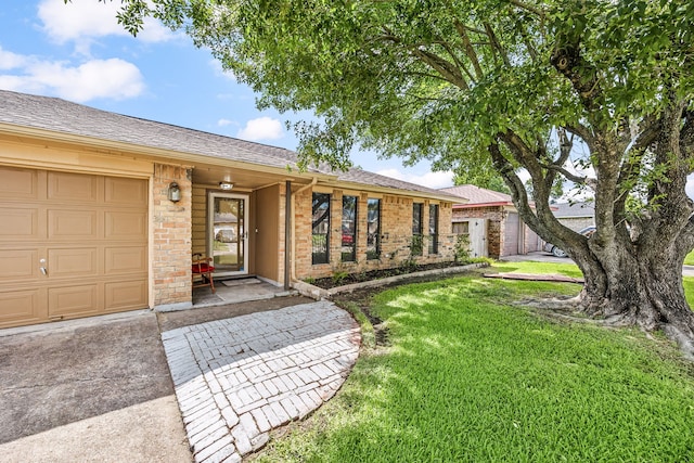 1343 Somercotes Ln, Channelview, TX 77530 - single story home featuring a front lawn, brick siding, a shingled roof, and concrete driveway