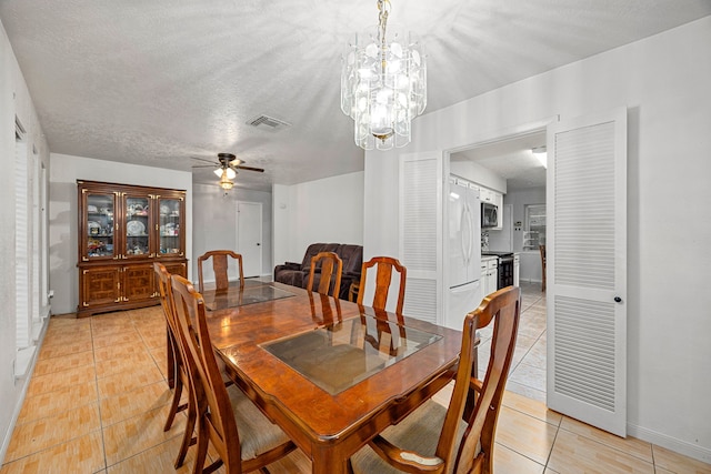 1343 Somercotes Ln, Channelview, TX 77530 - dining space featuring light tile patterned flooring, baseboards, a chandelier, and ceiling fan