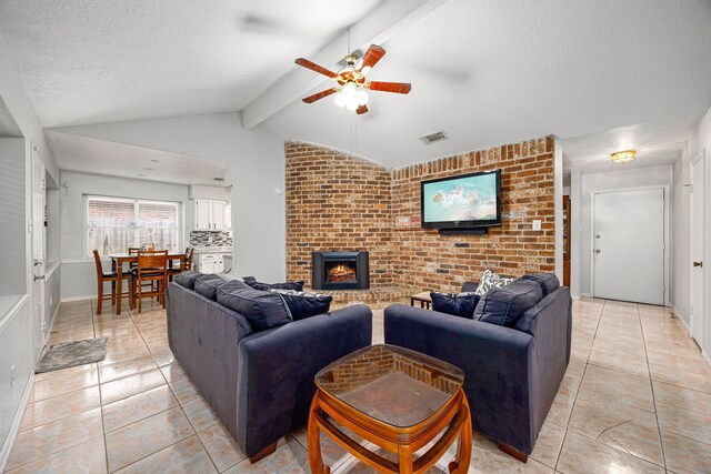 1343 Somercotes Ln, Channelview, TX 77530 - living area with a ceiling fan, a textured ceiling, light tile patterned floors, and a fireplace